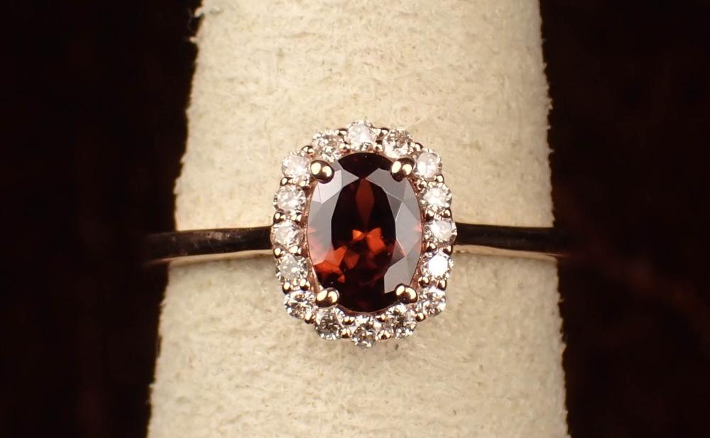 Appraisal: GARNET DIAMOND AND FOURTEEN KARAT GOLD RING The rose gold