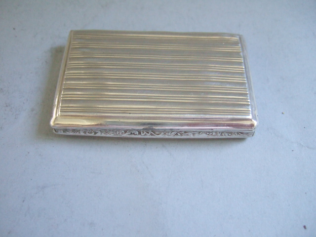 Appraisal: A French rectangular hinge lidded snuff box the lid engine