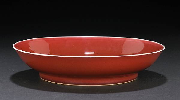 Appraisal: A copper red glazed porcelain deep dish Yongzheng Mark and