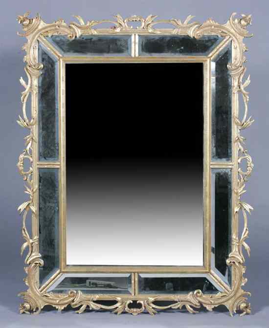 Appraisal: GILT RECTANGULAR WALL MIRROR Frame constructed of eight canted mirror