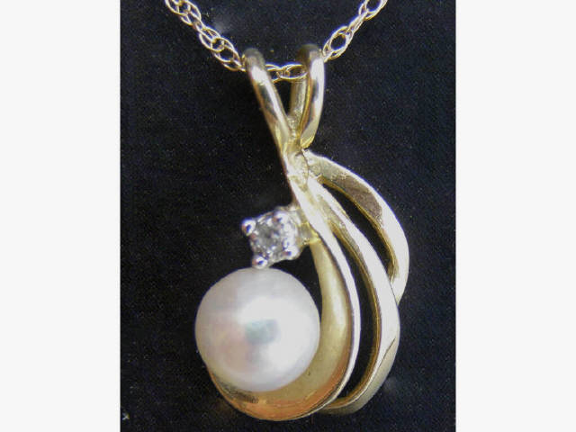 Appraisal: Stylish K yellow gold lady's round and cultured pearl and