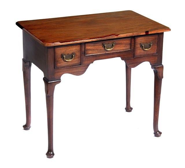 Appraisal: A GEORGE III MAHOGANY LOW BOY with rectangular top and