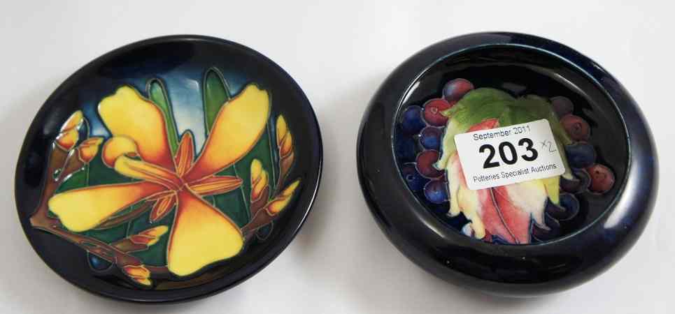 Appraisal: Moorcroft Leaf and Berry Small Dish and a Coaster for