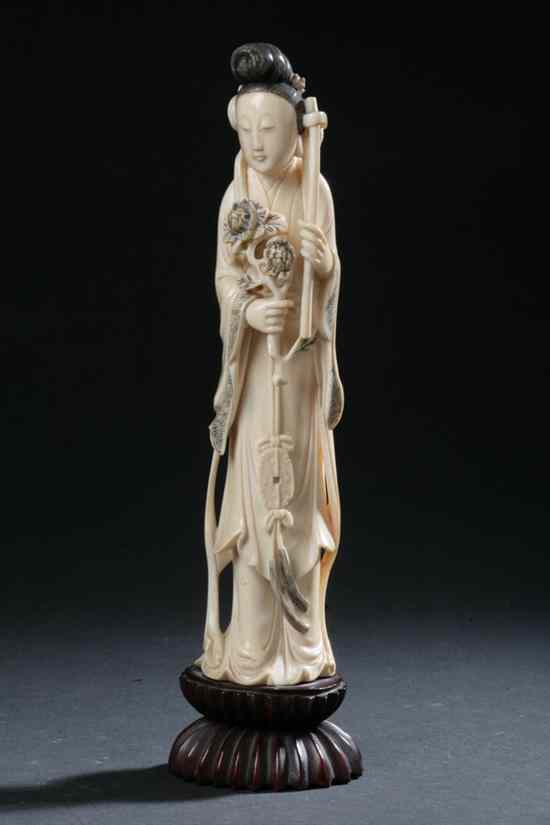 Appraisal: CHINESE IVORY FIGURE OF DEITY Qing dynasty Standing wearing long