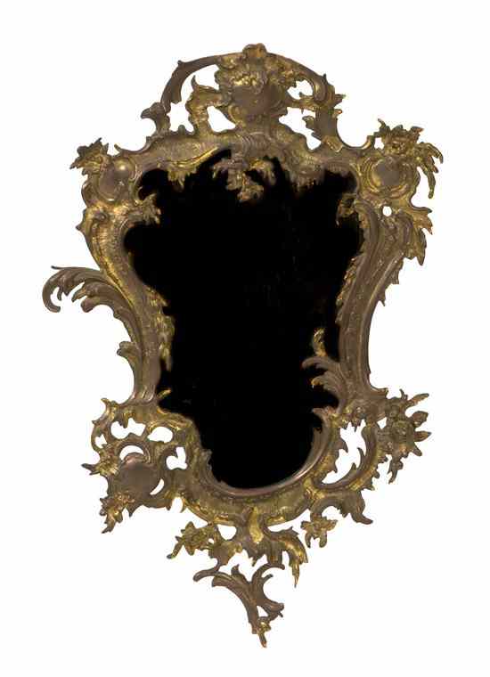 Appraisal: A Rococo Style Gilt Metal Mirror of cartouche form with