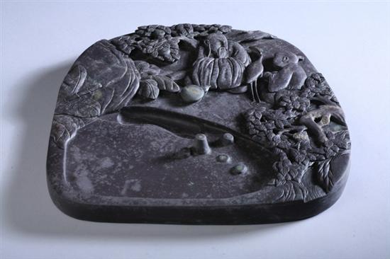 Appraisal: CHINESE INKSTONE Carved to depict man bird and attendant under