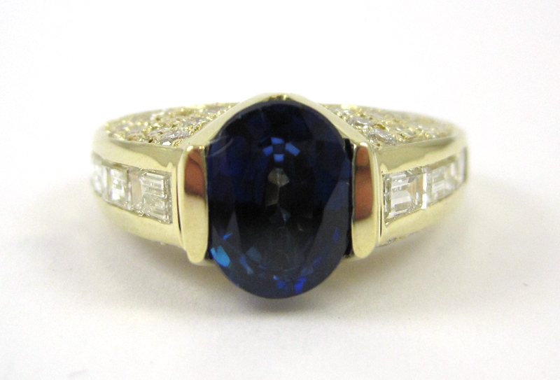 Appraisal: SAPPHIRE DIAMOND AND FOURTEEN KARAT GOLD RING with round-cut and