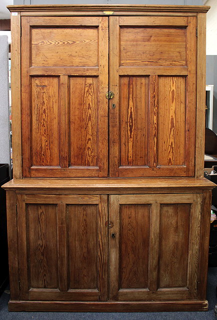 Appraisal: A VICTORIAN PITCH PINE CABINET panelled doors above and below