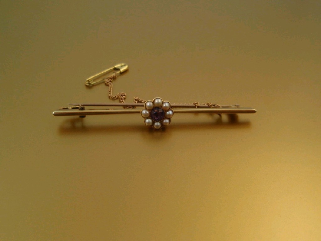 Appraisal: A bar brooch with amethyst and seed pearl set floral