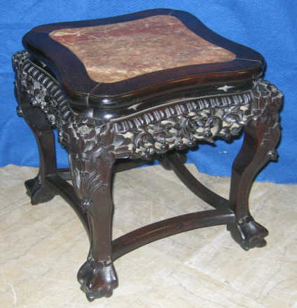 Appraisal: ASIAN HARDWOOD FERN STAND Shaped top with inset marble showing