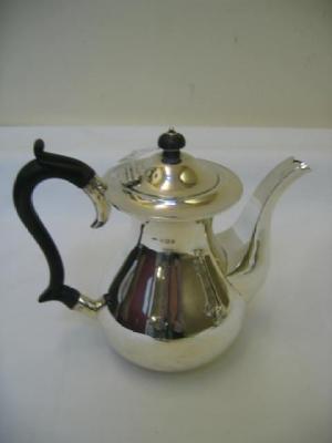 Appraisal: A COFFEE POT of baluster form with turned ebony finial