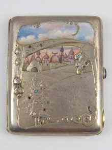 Appraisal: A Russian silver cigarette case with blue cabochon thumpiece jewelled