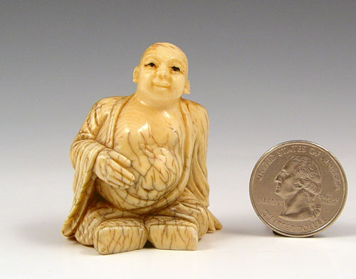 Appraisal: JAPANESE CARVED IVORY SEATED MAN NETSUKE Signed in characters on