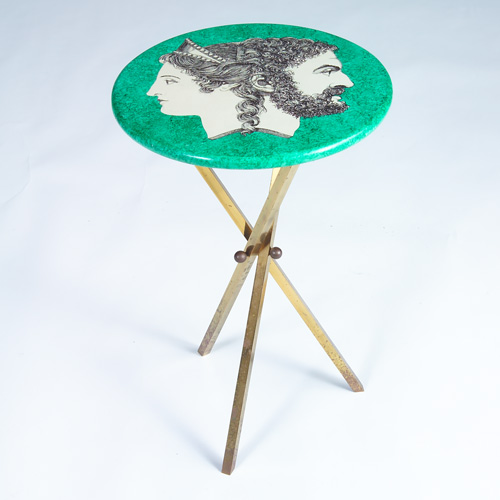 Appraisal: PIERO FORNASETTI Small side table decorated with classically-rendered portraits of