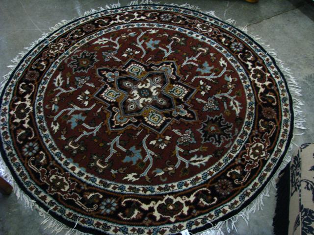 Appraisal: Vintage ' round Oriental rug brown field with navy border