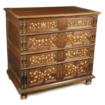 Appraisal: A rare Charles II oak chest on truckle wheels the