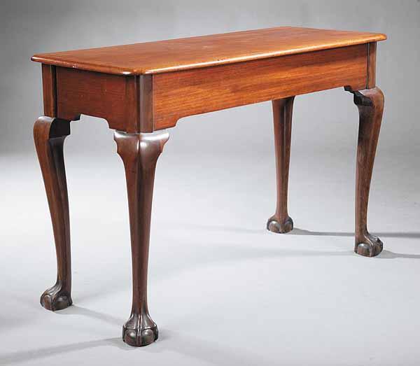 Appraisal: An Antique Chippendale-Style Mahogany Hall Table the rectangular top above