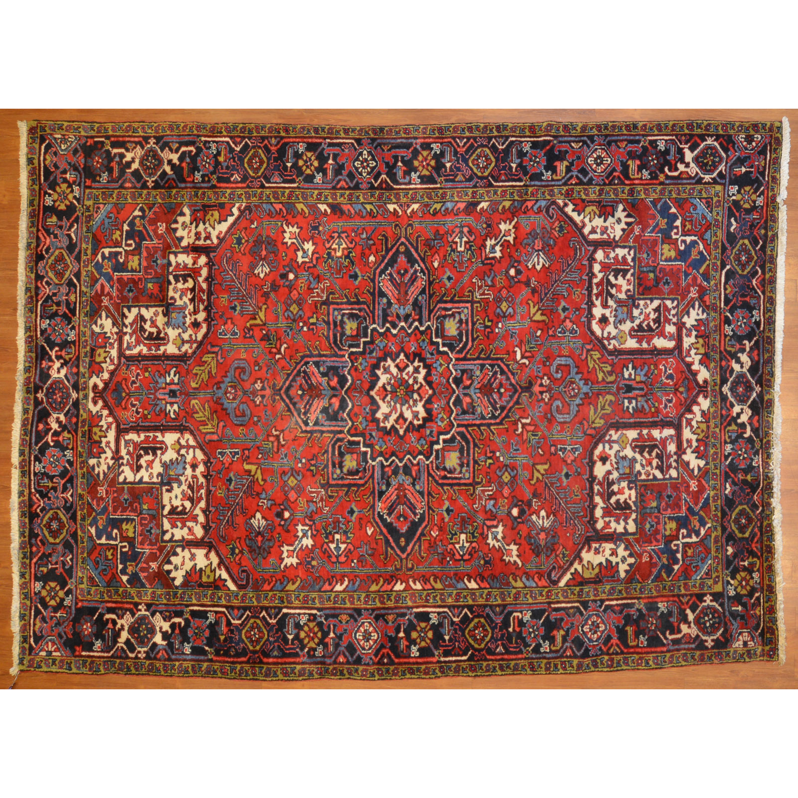 Appraisal: HERIZ RUG PERSIA X Fourth quarter- th century hand-knotted wool