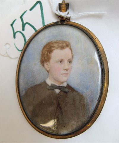 Appraisal: GILT OVAL COLOR PORTRAIT PENDANT the drawing of a young