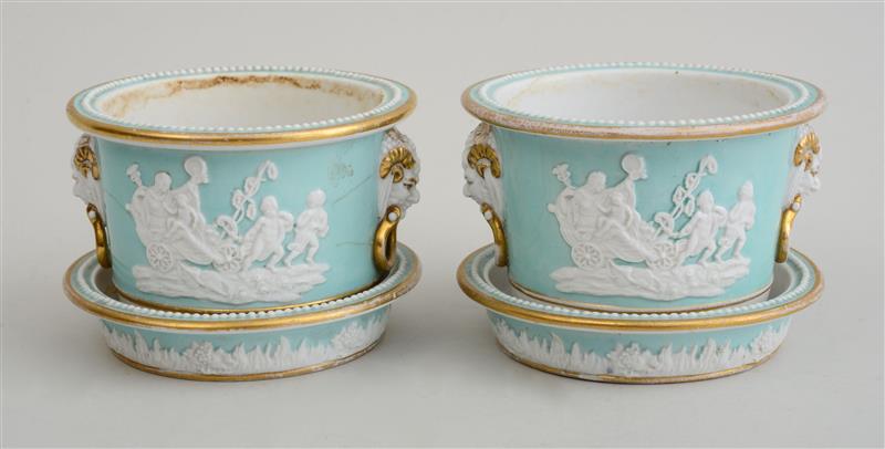 Appraisal: PAIR OF ENGLISH TURQUOISE-GROUND PORCELAIN CACHEPOTS AND STANDS Each with