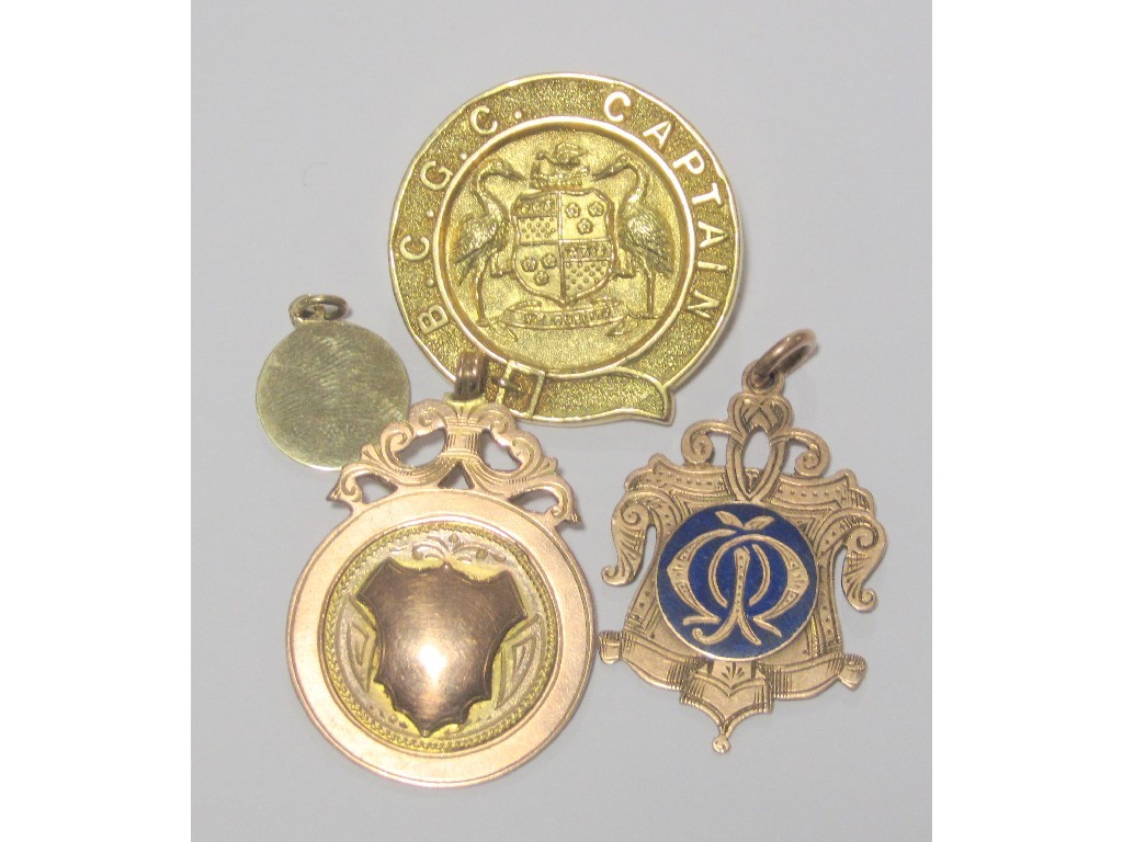 Appraisal: Three ct gold presentation medals and a pendant Total approximate