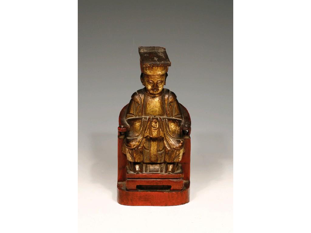 Appraisal: A CHINESE CARVED WOOD TEMPLE FIGURE the seated figure with