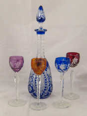 Appraisal: A liqueur set comprising a cut glass blue overlay decanter