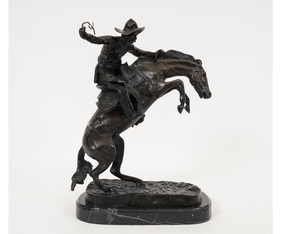 Appraisal: Frederic Remington after bronze Bronco Buster mounted on a black