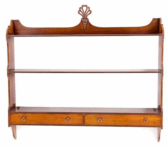 Appraisal: Regency style mahogany curio shelf late th century shaped backsplash