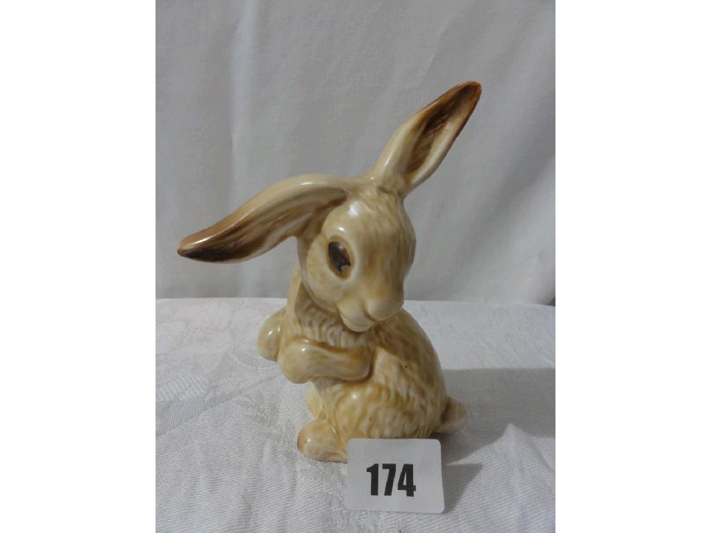 Appraisal: A Sylvac buff glazed model of a humorous rabbit with