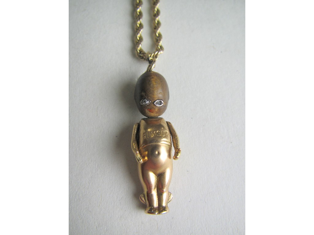 Appraisal: Fifteen carat gold Fumsup doll charm on ct rose gold