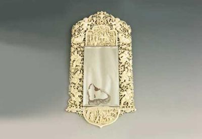 Appraisal: A late th century Chinese carved ivory wall mirror decorated