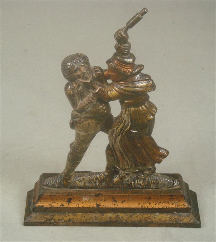 Appraisal: Cast iron doorstop man and woman in domestic dispute gold