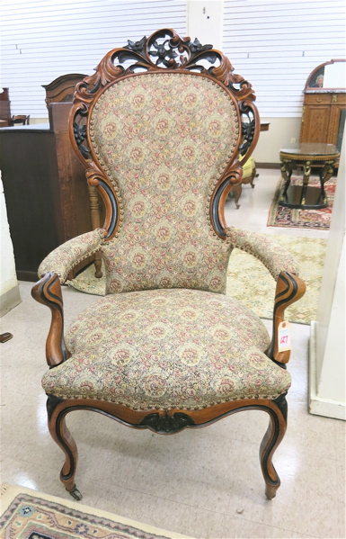 Appraisal: A VICTORIAN CARVED AND UPHOLSTERED WALNUT ARMCHAIRS Louis XV substyle