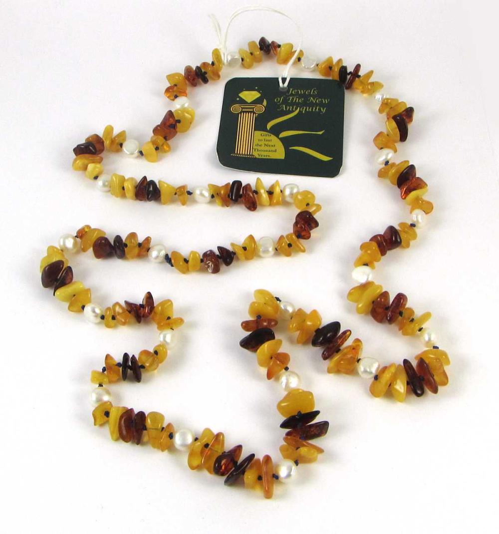 Appraisal: BALTIC AMBER AND PEARL ROPE LENGTH BEAD NECKLACE hand-knotted blue