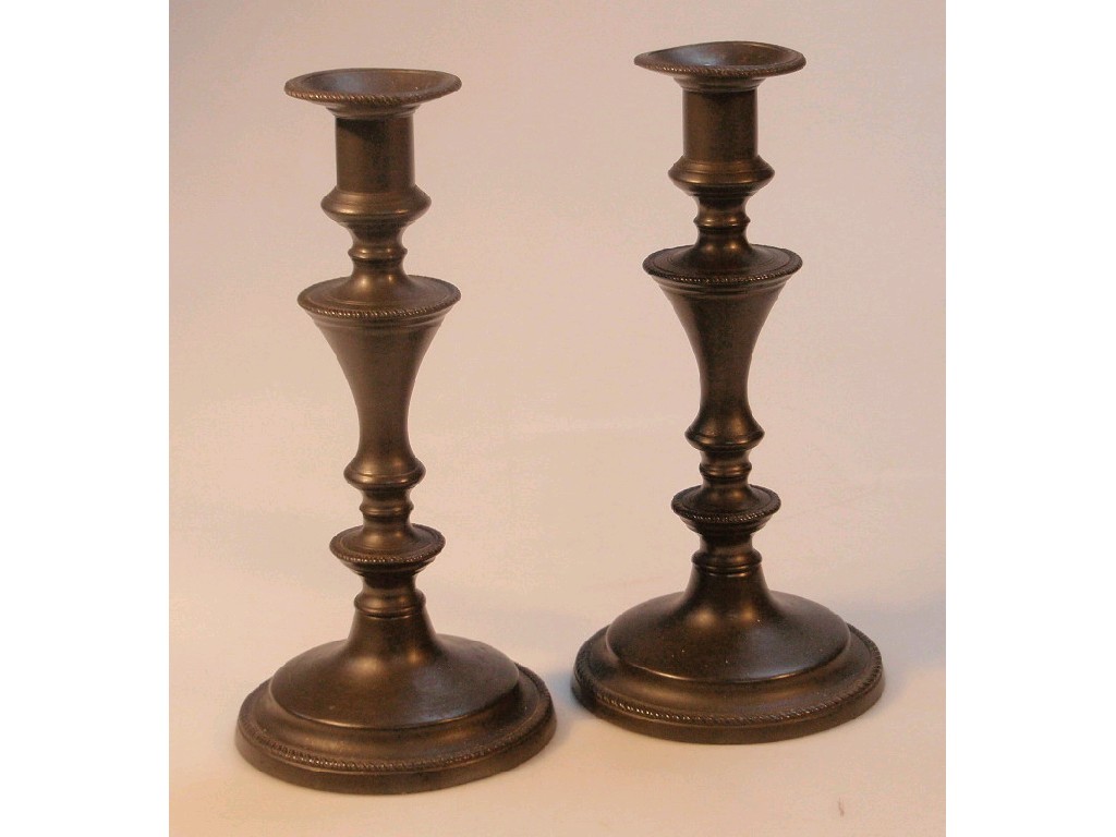 Appraisal: A pair of thC pewter candlesticks with gadroon rims the