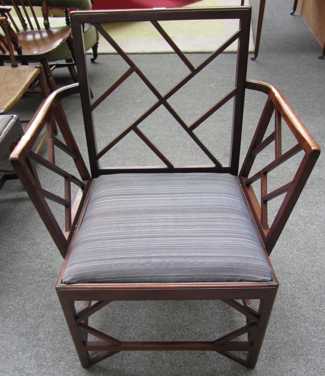 Appraisal: An early th century mahogany framed cock pen armchair with