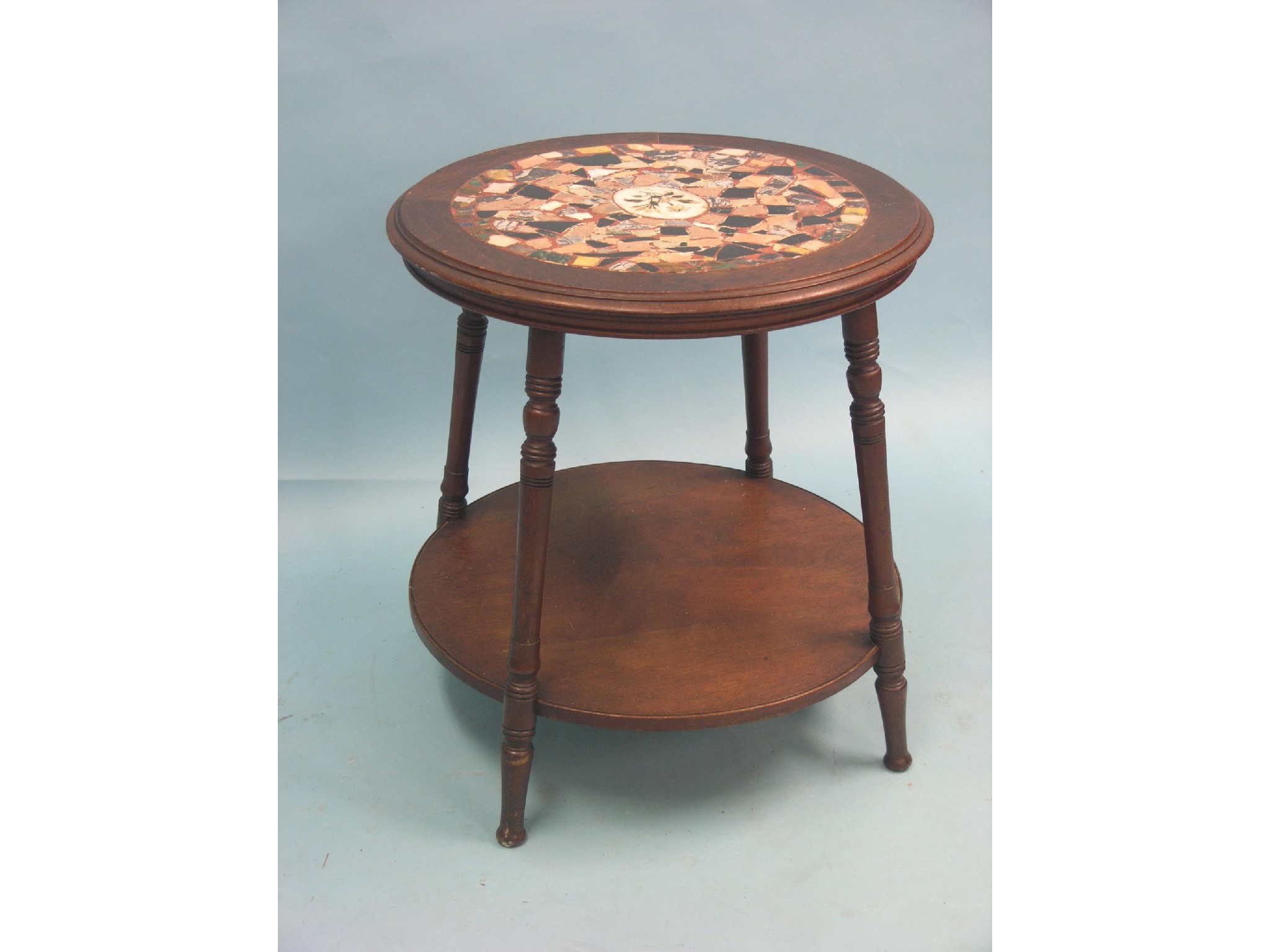 Appraisal: A Victorian walnut tavern table circular-shape with undertier top inlaid