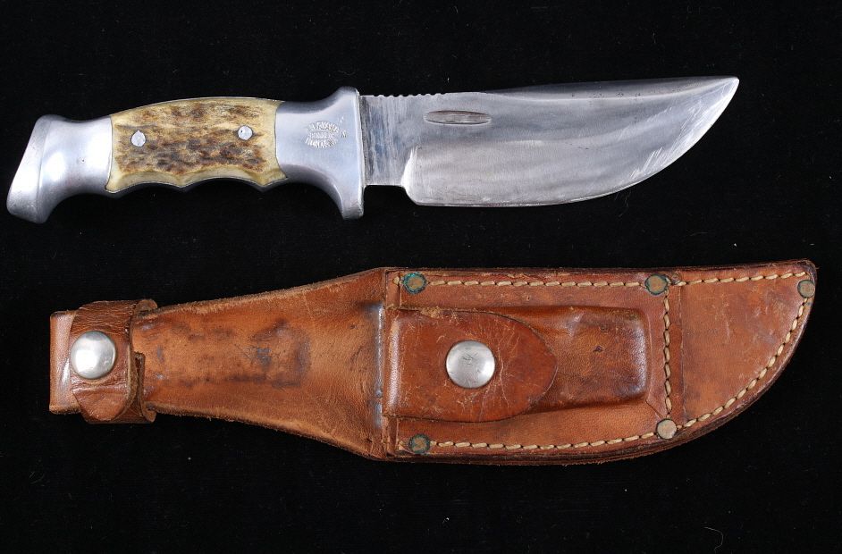 Appraisal: R H Ruana Camp Knife Leather Scabbard This is an