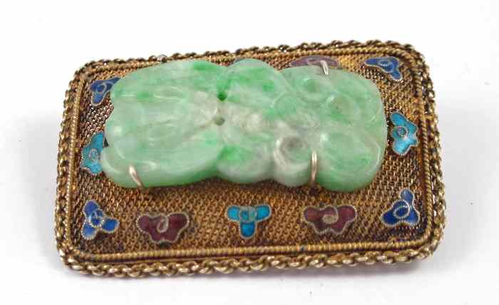 Appraisal: CHINESE CARVED JADE AND ENAMELED SILVER BROOCH the rectangular silver