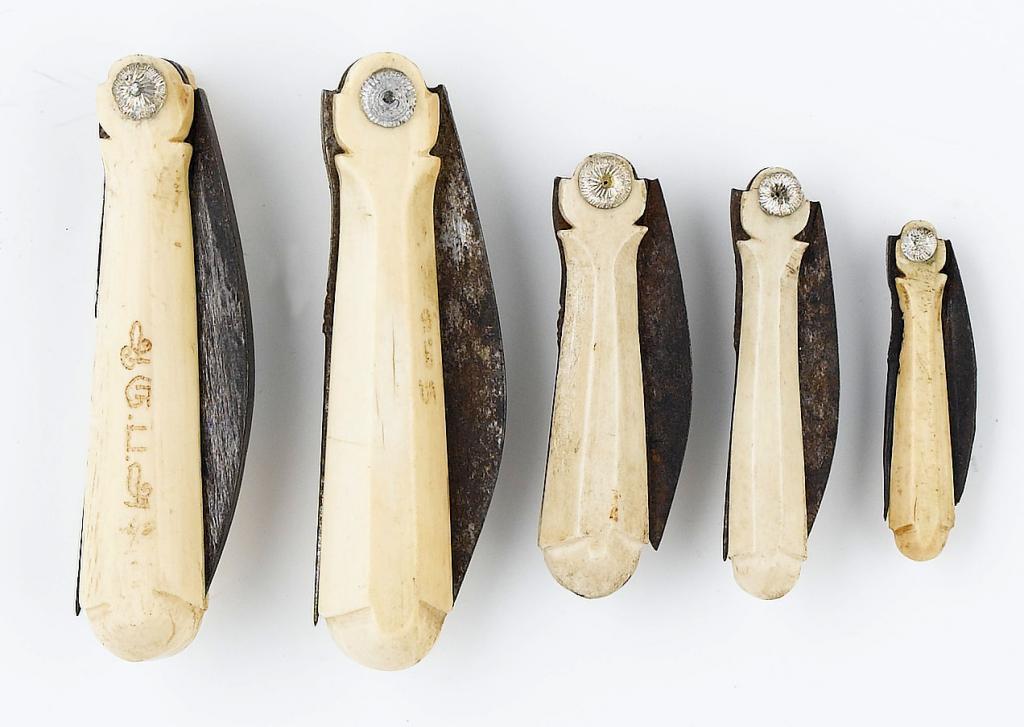 Appraisal: FIVE INDIAN BONE PENKNIVES of similar faceted form with steel