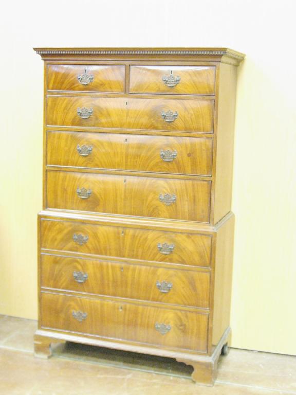 Appraisal: A late Georgian mahogany Chest on Chest with dentil cornice