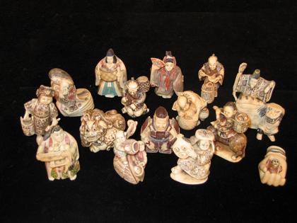 Appraisal: Sixteen Japanese elephant and mammoth ivory netsuke and table studies