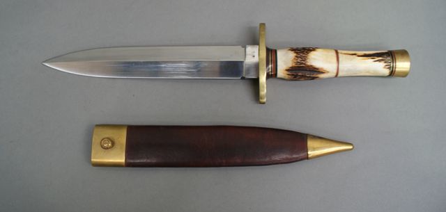 Appraisal: An English spear point Bowie knife inch double edged blade