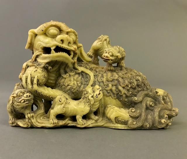 Appraisal: Chinese Steatite Carved Buddhistic Lion with Cubs Chinese steatite carved