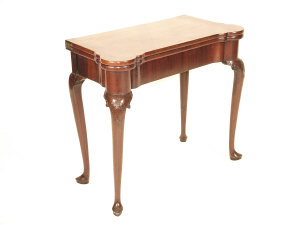 Appraisal: A George II mahogany foldover card table circa the shaped