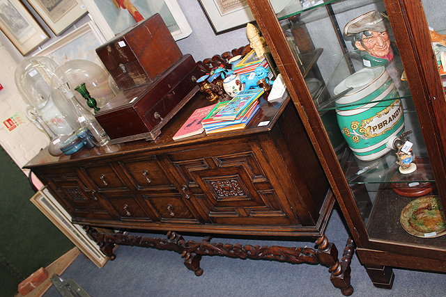 Appraisal: AN EARLY TH CENTURY OAK SIDEBOARD the raised carved back