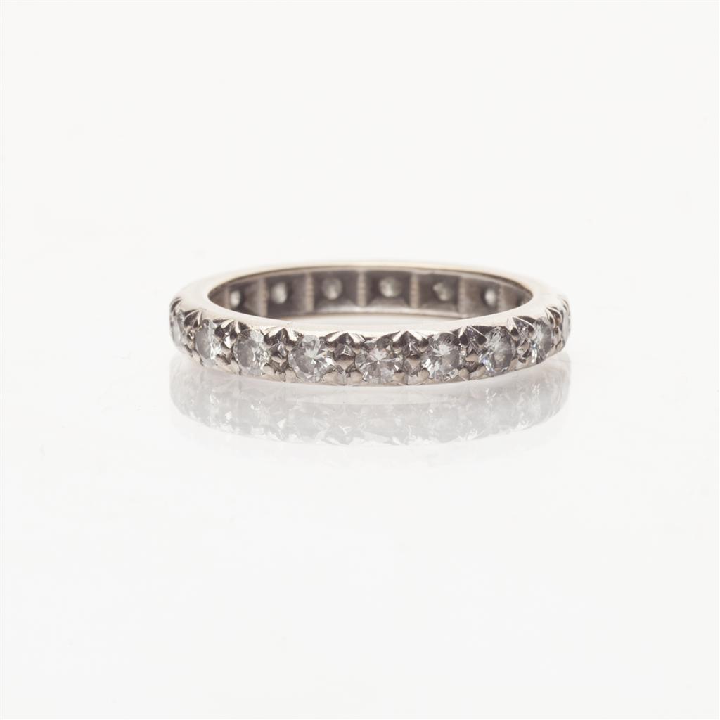 Appraisal: A diamond set eternity ring claw set throughout with small