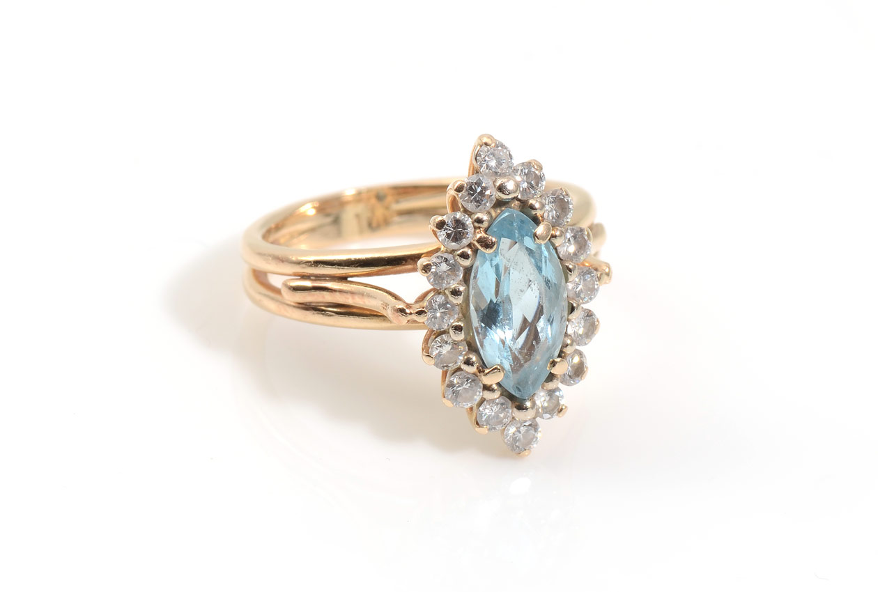 Appraisal: AQUAMARINE DIAMOND RING K yellow gold ring centers an approx