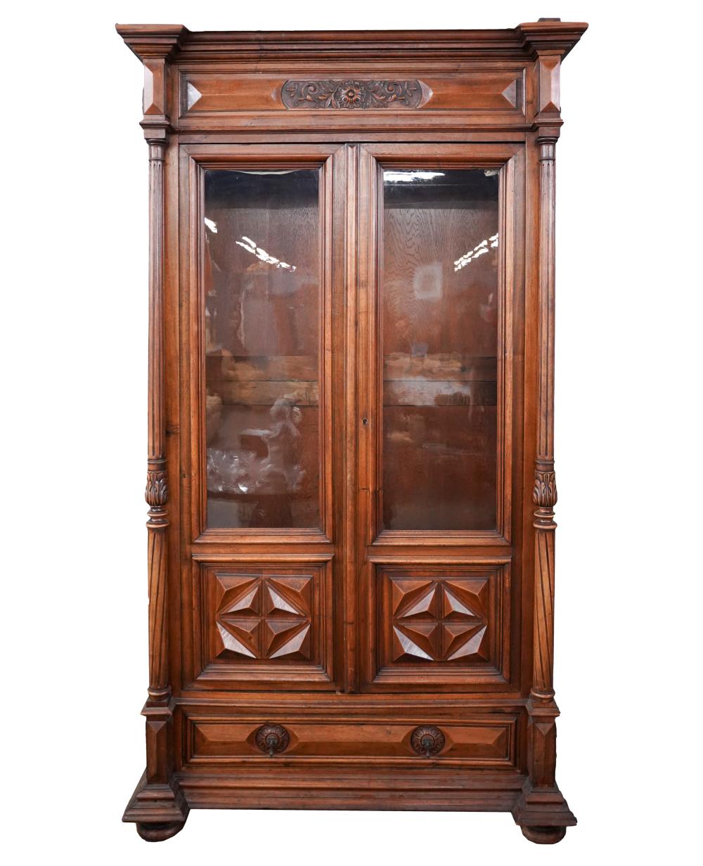 Appraisal: CARVED WALNUT BOOKCASE CABINETthe hinged doors inset with glass enclosing